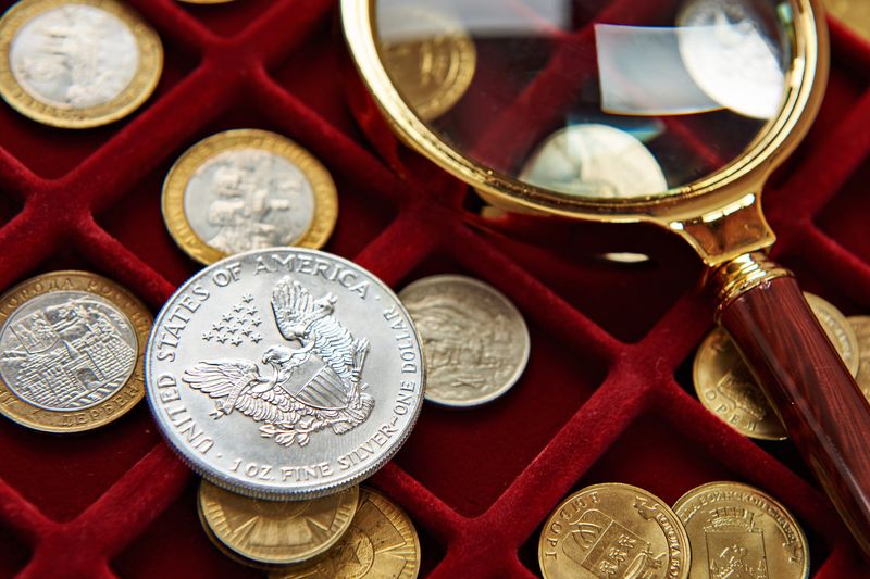 Silver Eagle under a magnifying glass on a red tray during a Dallas appraisal