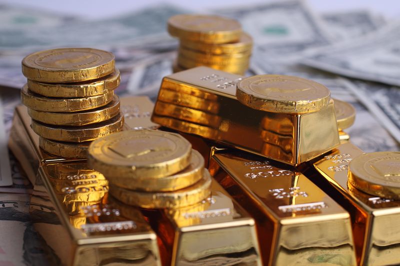 Gold coins and small gold bars like those sold by Richardson, Texas owners